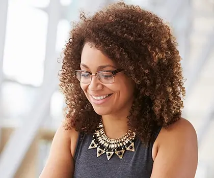 A woman with glasses working