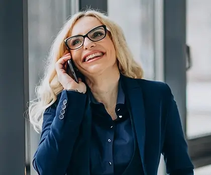 Business woman talking and laughing on the phone